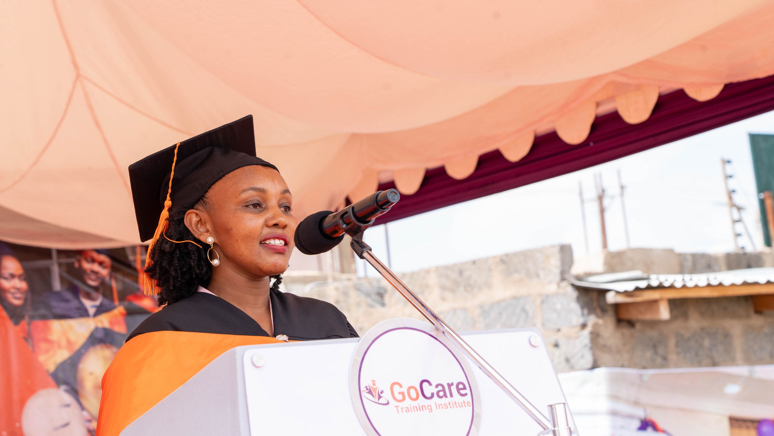 GoCare valedictorian speaking at graduation